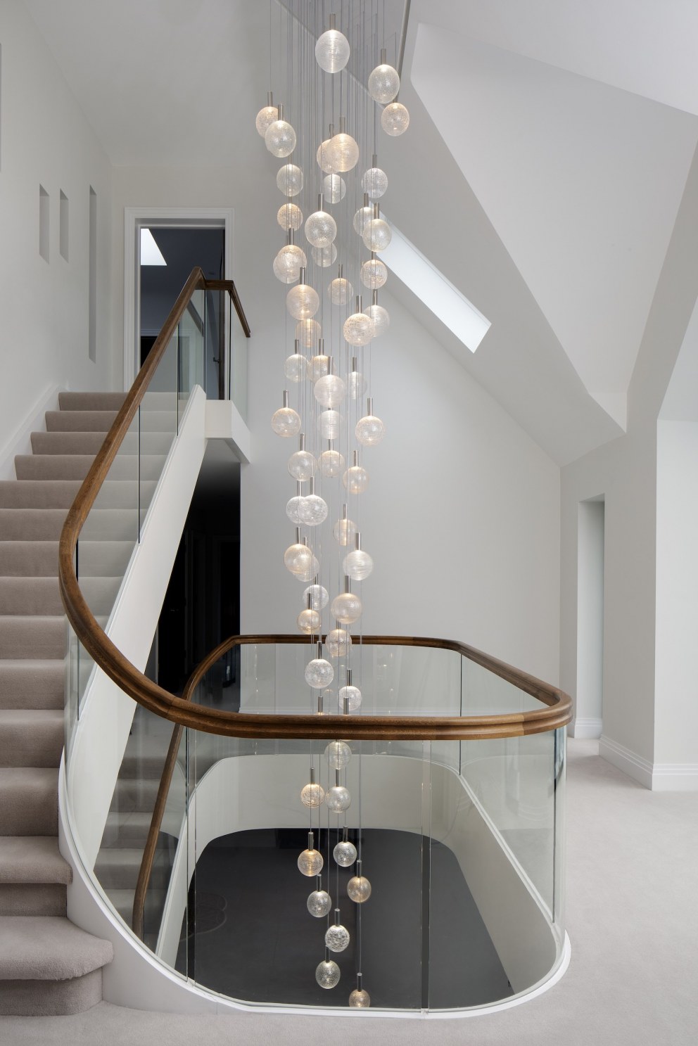 Hampshire famility residence | Staircase and chandelier | Interior Designers